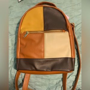 Wild Fable back pack purse.Shades of brown with front pocket & adjustable straps